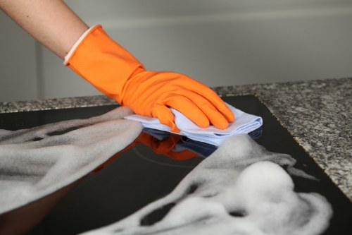 Detailed post-construction cleaning in a W12 kitchen after renovation